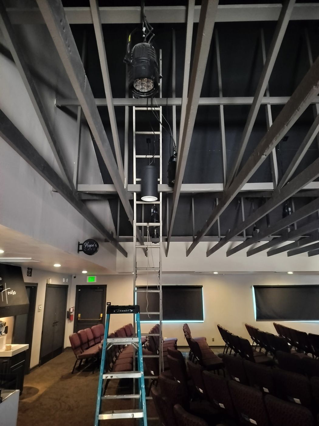 Commercial stage lighting fixture mounted on a ceiling truss