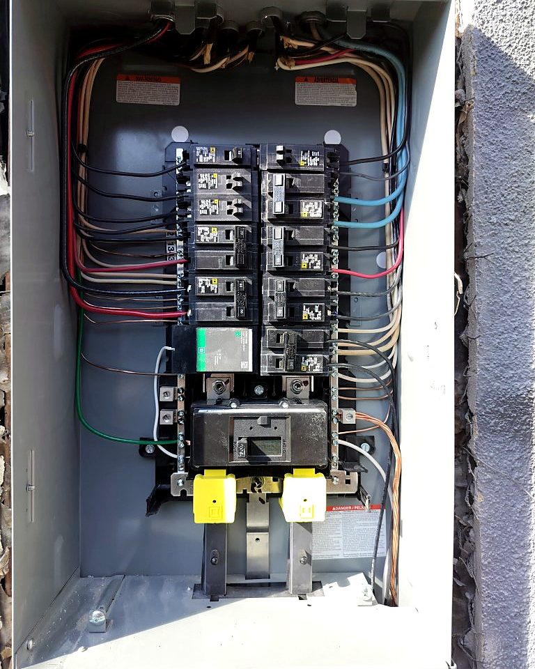 Upgraded electrical panel with new breakers and neatly routed wiring