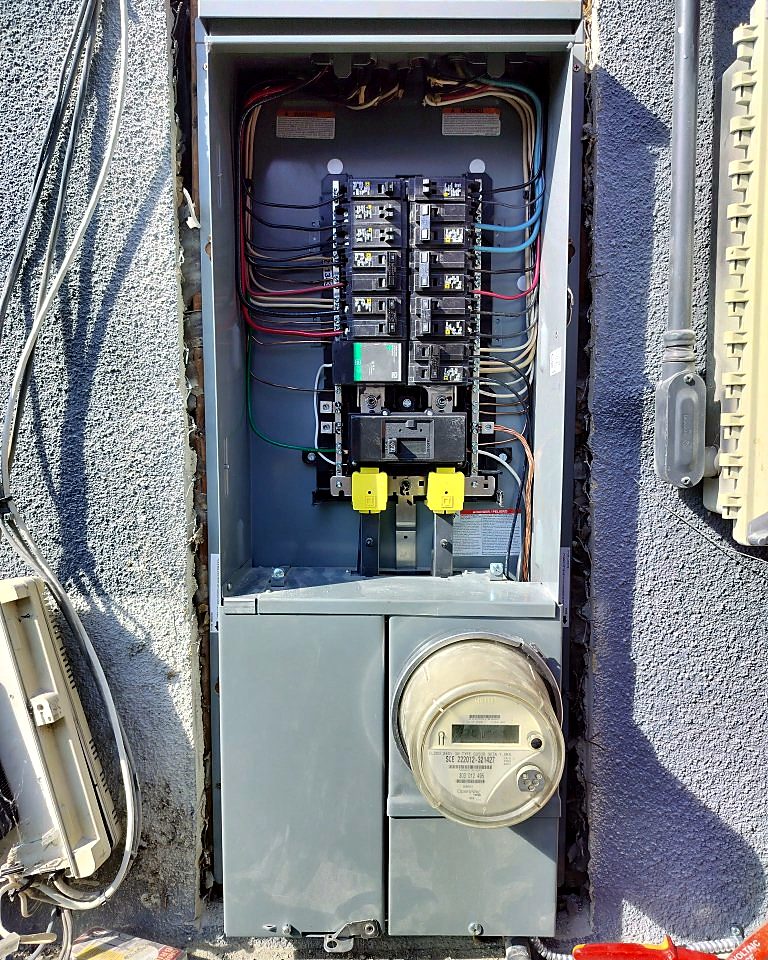 New exterior meter and main panel combination installed on a home